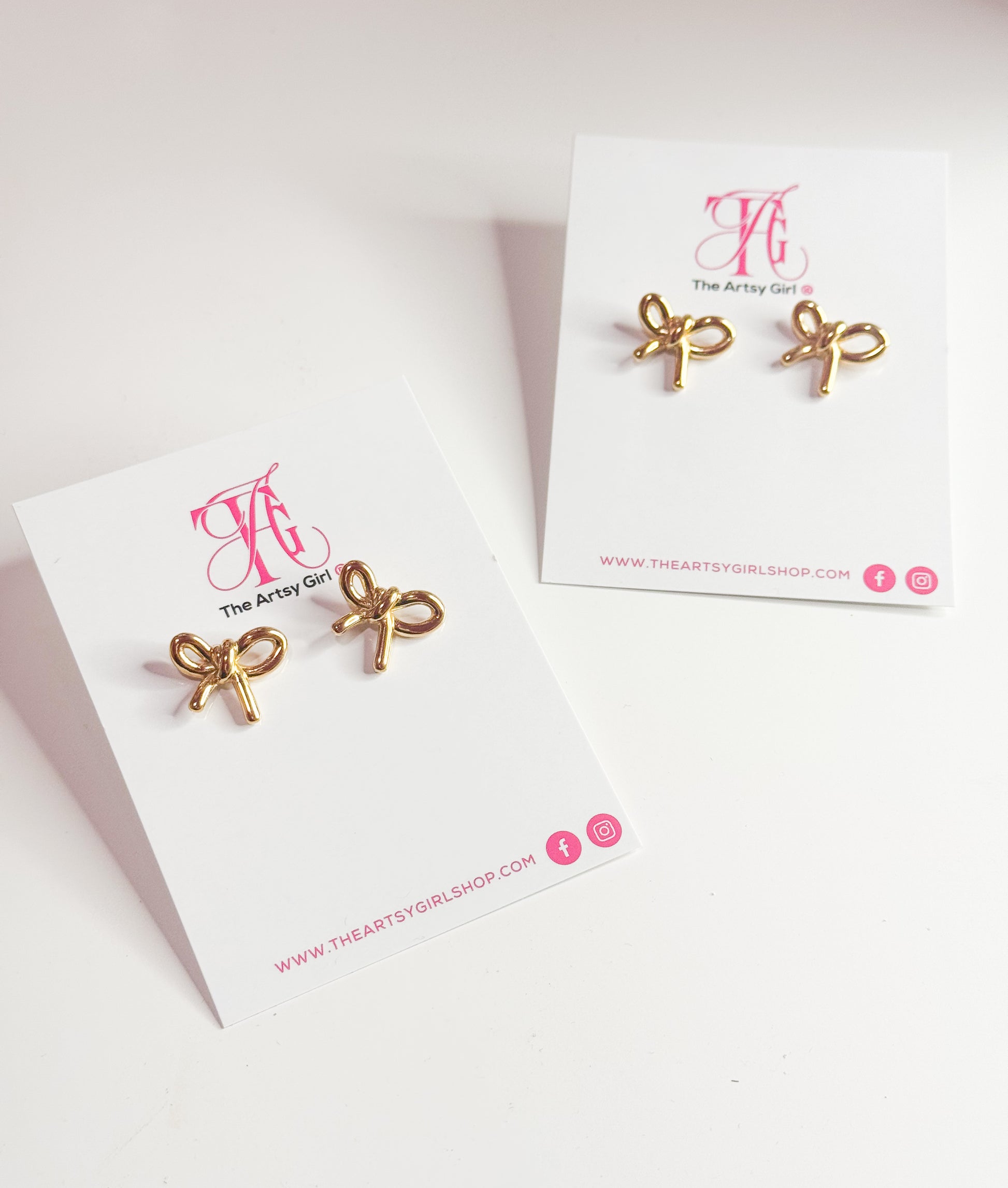 Close-up image of gold tarnish-free bow stud earrings with a sleek, shiny finish. These delicate earrings feature a classic bow design, perfect for adding a touch of elegance and charm to any outfit.