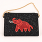 A black beaded clutch bag with a gold chain strap, featuring a red beaded elephant design on the front.