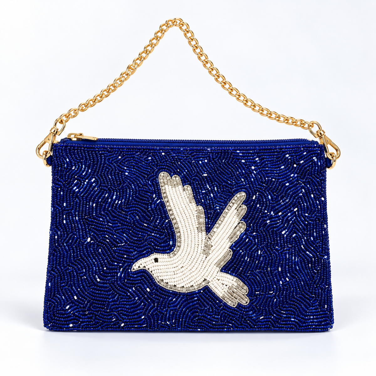 A royal blue beaded clutch bag featuring a large white beaded dove motif on the front, a gold-tone chain shoulder strap, and a gold zipper closure, set against a plain white background.