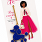 Blue beaded poodle bag charm on a white card with 'The Artsy Girl' branding.