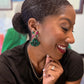 Model wearing AKA inspired earrings 