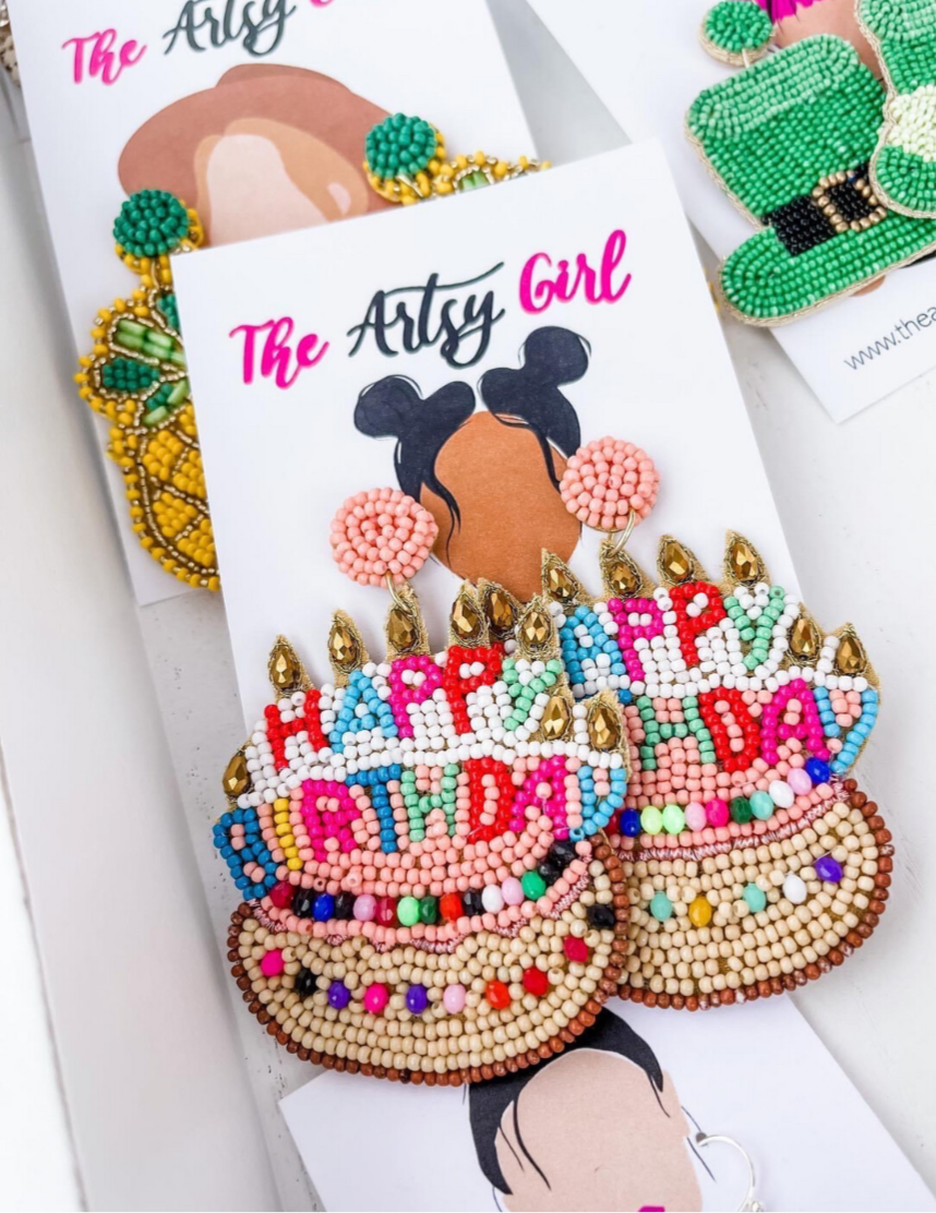 A customer favorite and conversation starter! Birthday Cake earrings adorned with bright, happy colors, featuring candle embellishments and a post back. Perfect for your next birthday celebration.