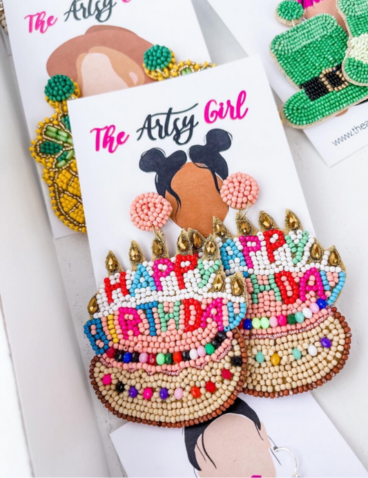 A customer favorite and conversation starter! Birthday Cake earrings adorned with bright, happy colors, featuring candle embellishments and a post back. Perfect for your next birthday celebration.