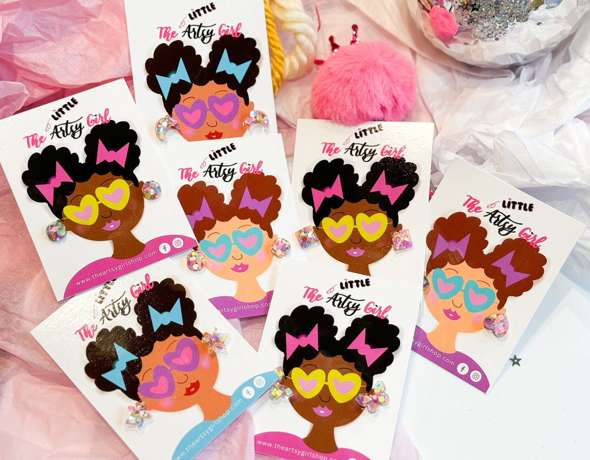 The Little Artsy Girl earrings on cards. 