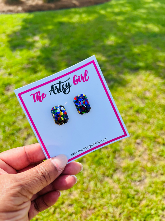 Big Stud Life oversized stud earrings crafted from glitter mixes and high-quality resin, featuring a vibrant emerald hue and dazzling sparkle. Perfect statement piece for any occasion, combining elegance and sophistication.