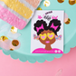 A small printed card or sticker featuring an illustrated Black woman with heart-shaped sunglasses and pink hair bows, placed on a scalloped aqua tray with gold confetti on a pink background. The card reads 'Little The Arts Girl' and includes a website at the bottom.