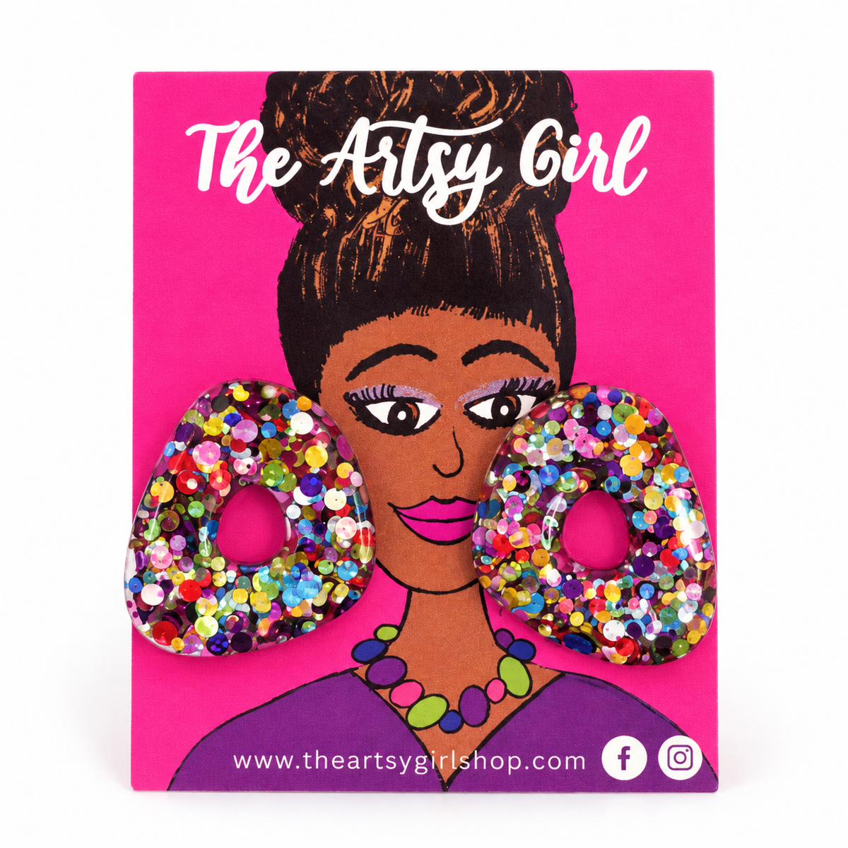 The Artsy Girl Handmade glitter earrings on a pink earring card. 