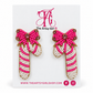 Pink and white beaded candy cane earrings with red bows and gold edging on The Artsy Girl card against a white background.