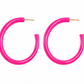A pair of open hoop earrings made of glossy hot pink material with gold-tone posts, displayed against a solid white background.