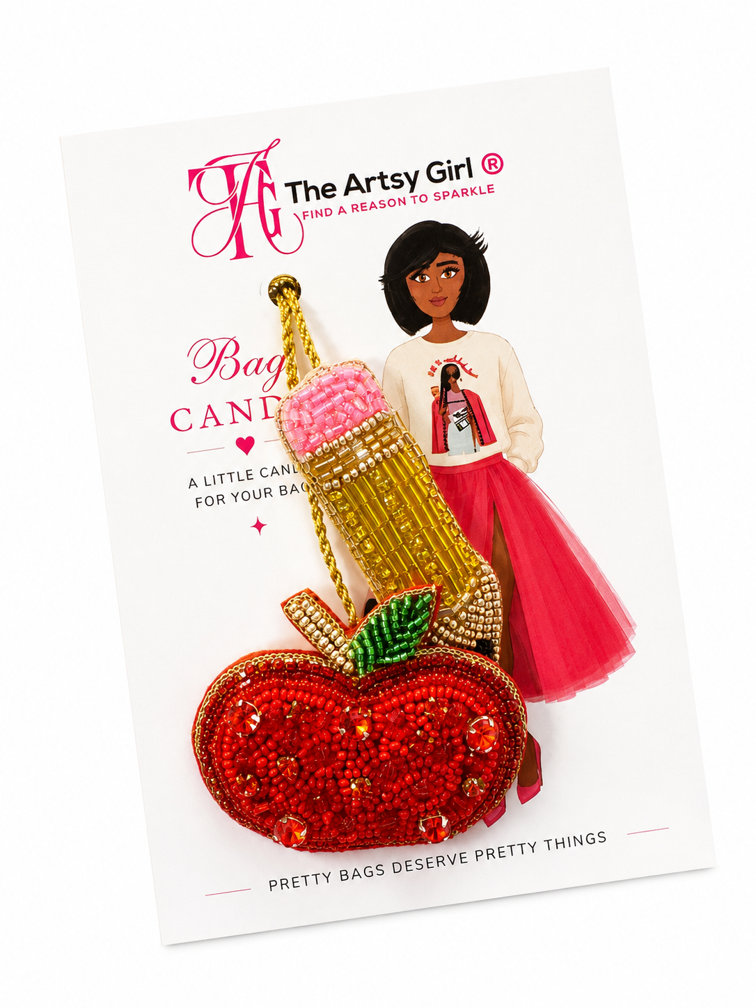 Decorative bag with candy design on a branded card featuring 'The Artsy Girl' logo.