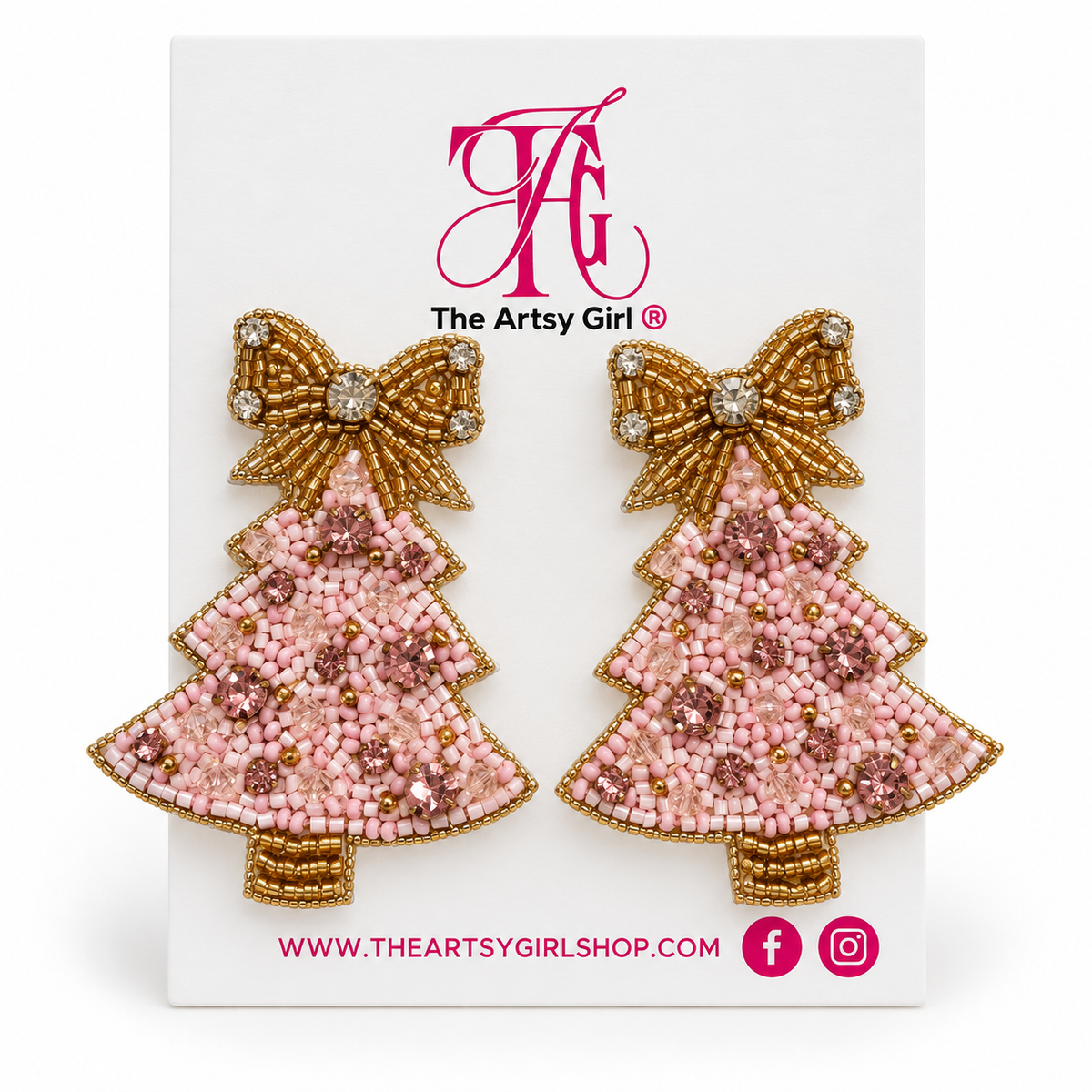 Blush pink beaded Christmas tree earrings with pink gemstones and gold bows on The Artsy Girl card against a white background.