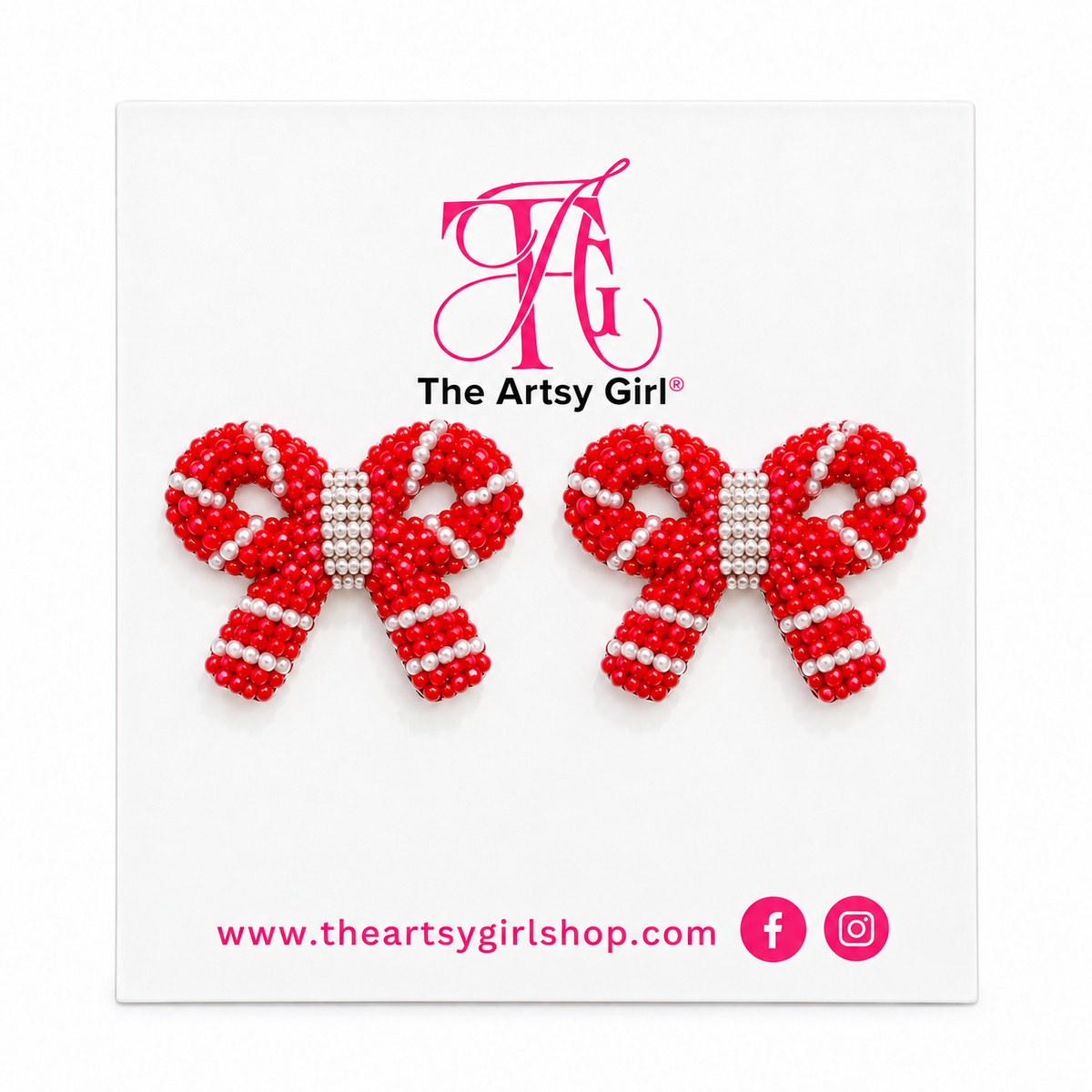 Red and white beaded bow stud earrings on The Artsy Girl display card against a white background.