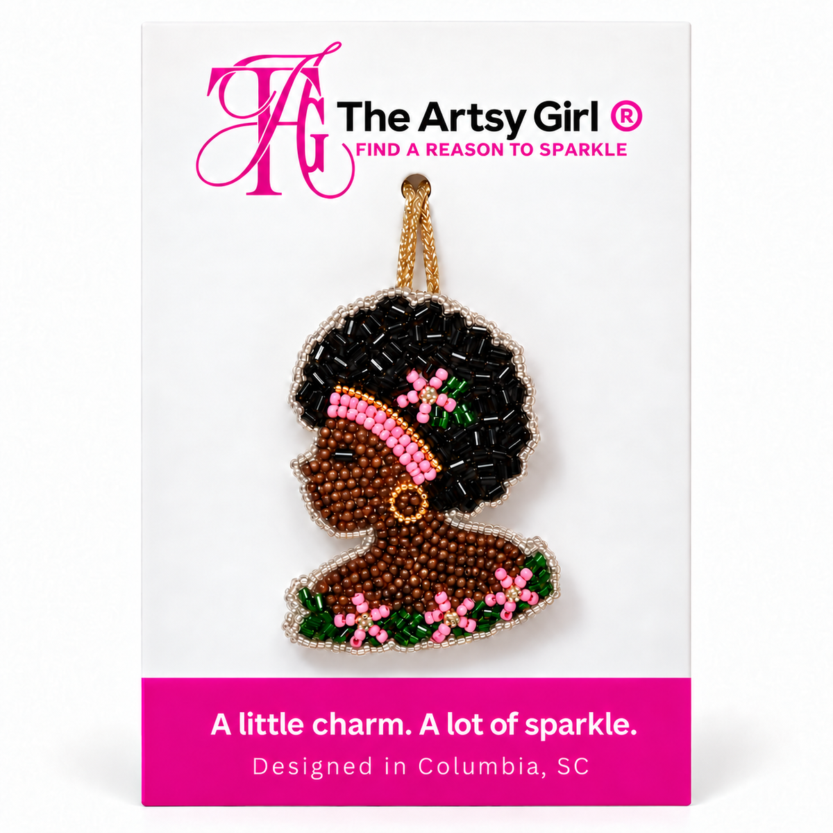 Beaded Black woman profile charm with an Afro, pink headband, gold hoop earring, and pink and green flowers on The Artsy Girl card.